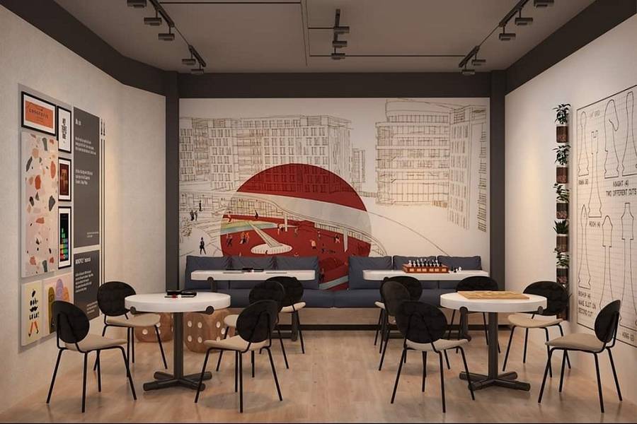 Ph&ograve;ng c&oacute; b&agrave;n ghế, tranh tường h&igrave;nh t&ograve;a nh&agrave;, đ&egrave;n trần, v&agrave; bảng trang tr&iacute;.