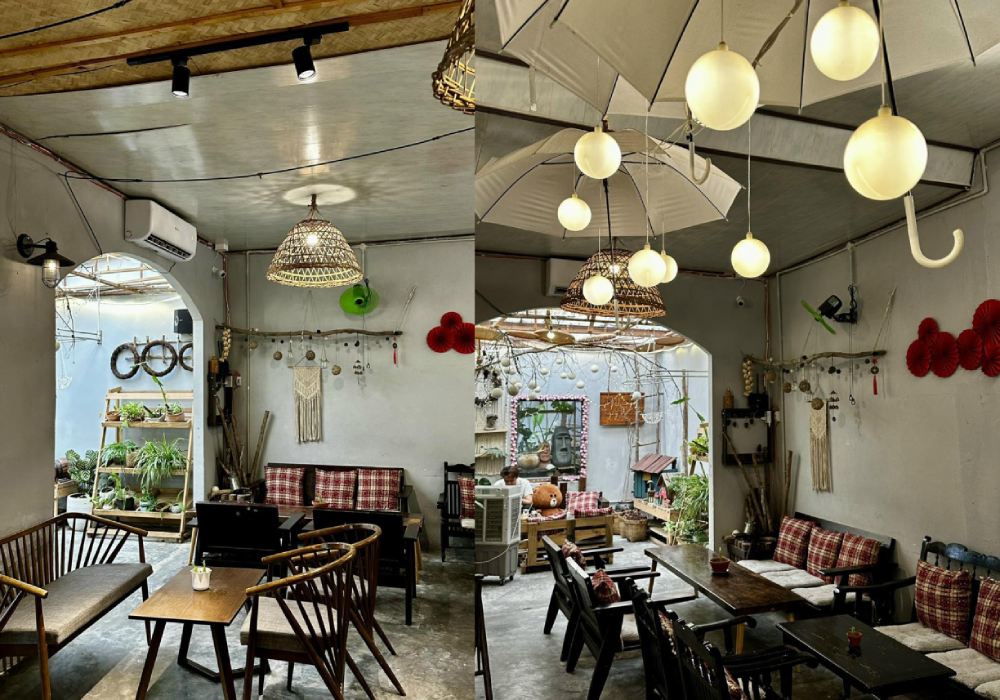 Top 11+ Quán Cafe Đẹp Tại Đà Nẵng Không Thể Bỏ Qua Năm 2025 22 Quán cà phê với nội thất gỗ, đèn trang trí và cây xanh, tạo không gian ấm cúng và thoải mái.