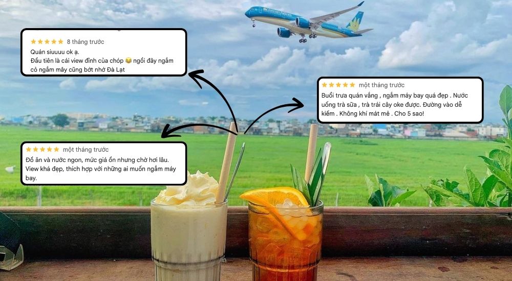 Khám Phá 10 Quán Cafe Gò Vấp Với Góc "Hidden Gem" Độc Đáo 11 Hai ly đồ uống trên bàn gỗ với nền là cánh đồng xanh và máy bay đang bay trên bầu trời.
