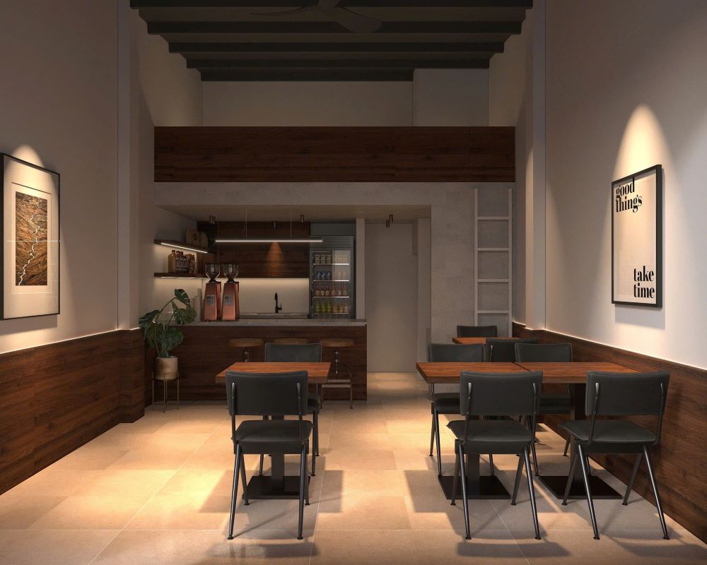 Khám Phá 10+ Quán Cafe Đẹp Nhất Long Biên: Thỏa Sức “Sống Ảo”, Thưởng Thức Đồ Uống Ngon 13 Quán cà phê với nội thất gỗ, bàn ghế đơn giản, tranh treo tường và kệ trưng bày ở phía sau quầy.