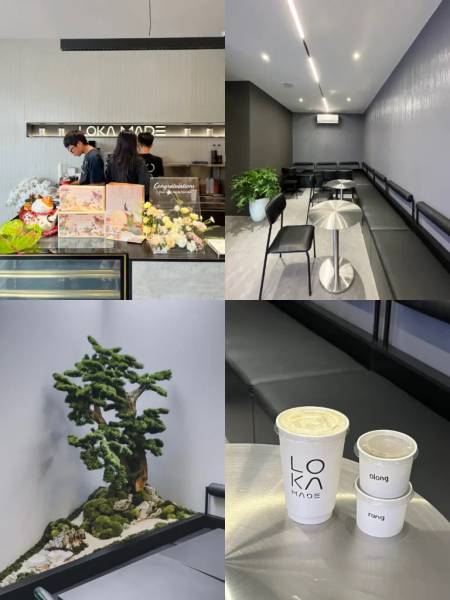 Qu&aacute;n c&agrave; ph&ecirc; hiện đại với nội thất tối giản, c&acirc;y cảnh trang tr&iacute; v&agrave; ly đồ uống mang nh&atilde;n hiệu tr&ecirc;n b&agrave;n.