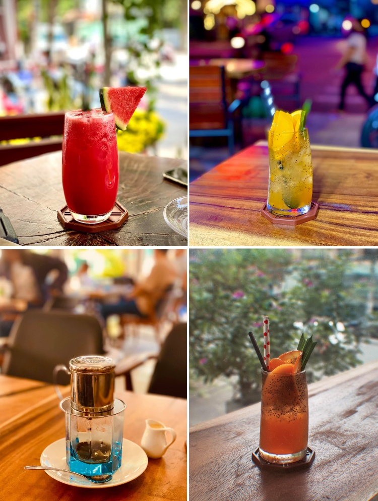 Bốn loại đồ uống kh&aacute;c nhau tr&ecirc;n b&agrave;n gỗ, gồm nước &eacute;p tr&aacute;i c&acirc;y v&agrave; c&agrave; ph&ecirc;, với ph&ocirc;ng nền mờ v&agrave; c&acirc;y xanh.