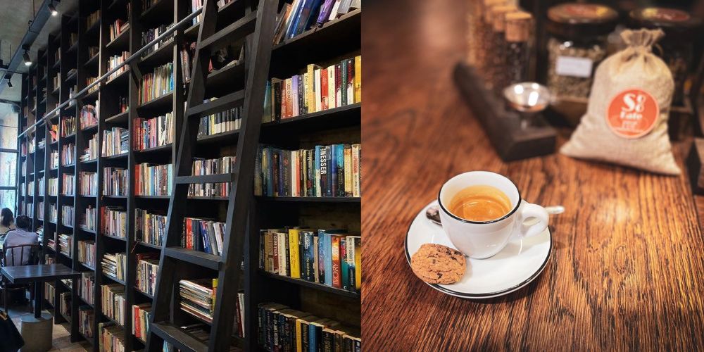 Khám Phá Top Quán Cafe Sách Hot Nhất Quận 1 Bạn Không Thể Bỏ Lỡ Năm Nay 9 Kệ sách cao đầy sách với cầu thang; bên cạnh, cốc cà phê và bánh quy trên bàn gỗ, xung quanh có túi nguyên liệu.