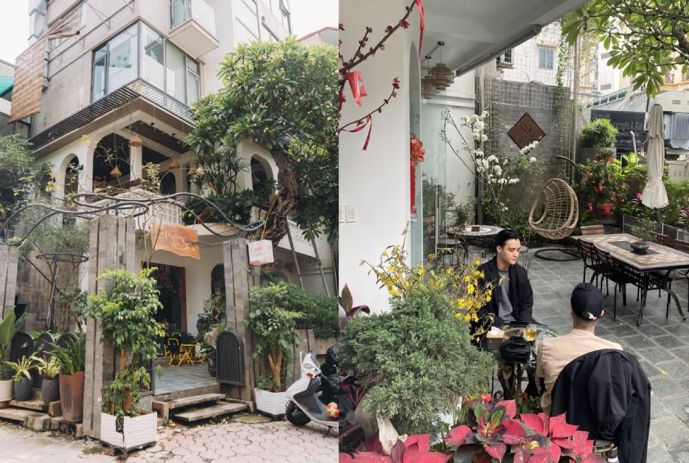 Khám Phá 11 Quán Cafe Đội Cấn Tuyệt Vời Cho Thư Giãn Và Làm Việc 30 Quán cà phê với kiến trúc độc đáo, cây xanh xung quanh và hai người ngồi trò chuyện trong sân.