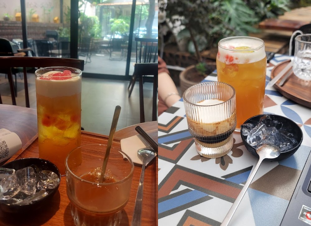 Khám Phá 11 Quán Cafe Đội Cấn Tuyệt Vời Cho Thư Giãn Và Làm Việc 8 Hai ly đồ uống trên bàn gỗ và bàn họa tiết, cạnh là chén nhỏ đựng đá và muỗng kim loại.
