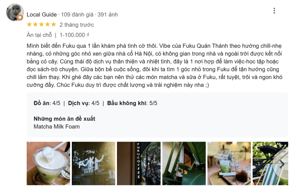 Khám Phá Top 10+ Quán Cafe Quán Thánh Lý Tưởng cho Hẹn Hò, Làm Việc và Thư Giãn 8 Đánh giá quán Fuku từ một người dùng, kèm hình ảnh đồ uống và không gian quán với cây xanh và bàn ghế.