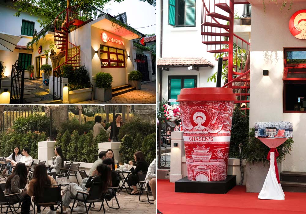 Khám Phá 8 Quán Cafe Lý Tưởng Trên Phố Phan Đình Phùng Cho Cuối Tuần Thư Giãn 10 Quán cà phê với cầu thang xoắn ốc đỏ, khách ngồi ngoài trời, trang trí bằng mô hình ly cà phê lớn.