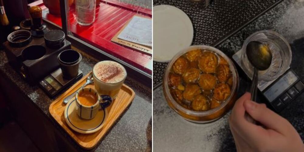 Khám Phá 9 Quán Cafe Độc Đáo Trên Đường Hoàng Hoa Thám 10 Bàn với khay đựng hai tách cà phê. Tay cầm muỗng lấy quất ngâm mật ong từ hũ thủy tinh.