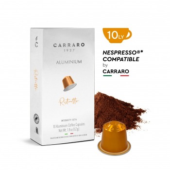 ca-phe-vien-nen-nhom-carraro-ristretto-202309151352_thumb Hộp cà phê viên nén Carraro và viên nén màu vàng cạnh đống bột cà phê trên nền trắng.