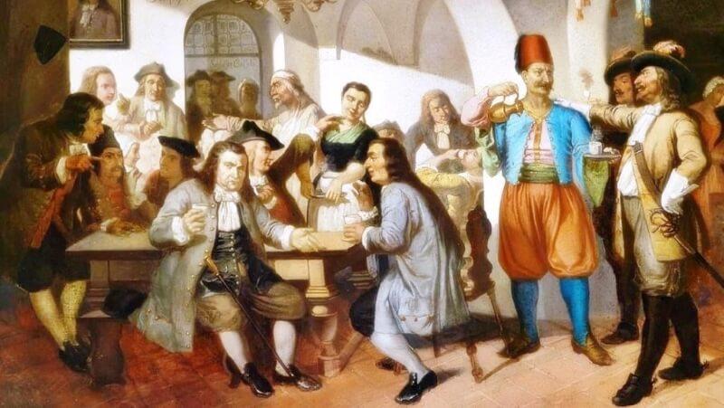 Một nhóm người trong trang phục cổ điển đang trò chuyện và thưởng thức đồ uống trong quán cà phê thời xưa.