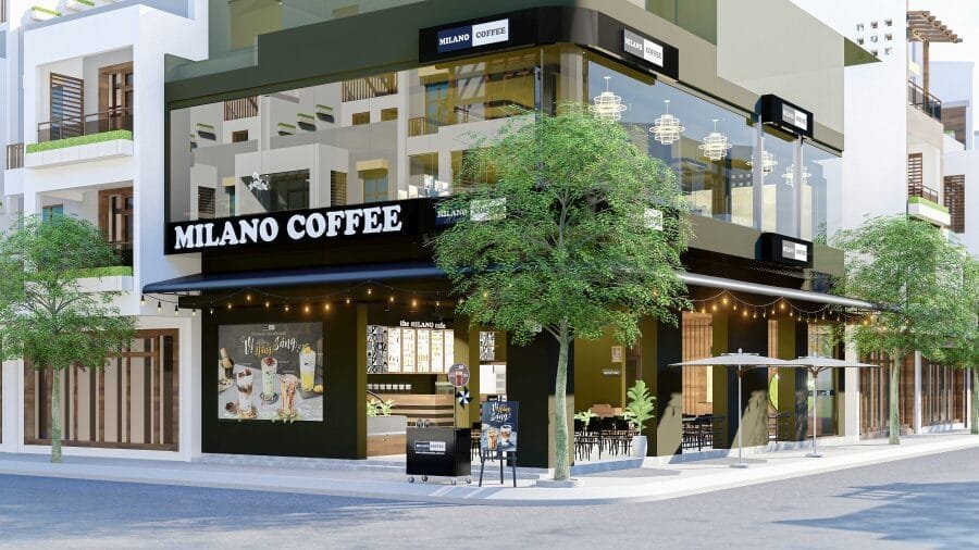 Nhượng quyền cafe Milano có chi phí bao nhiêu? Có nên không? 7 Quán cà phê hai tầng hiện đại với bảng hiệu "Milano Coffee", cửa kính lớn và cây xanh xung quanh.