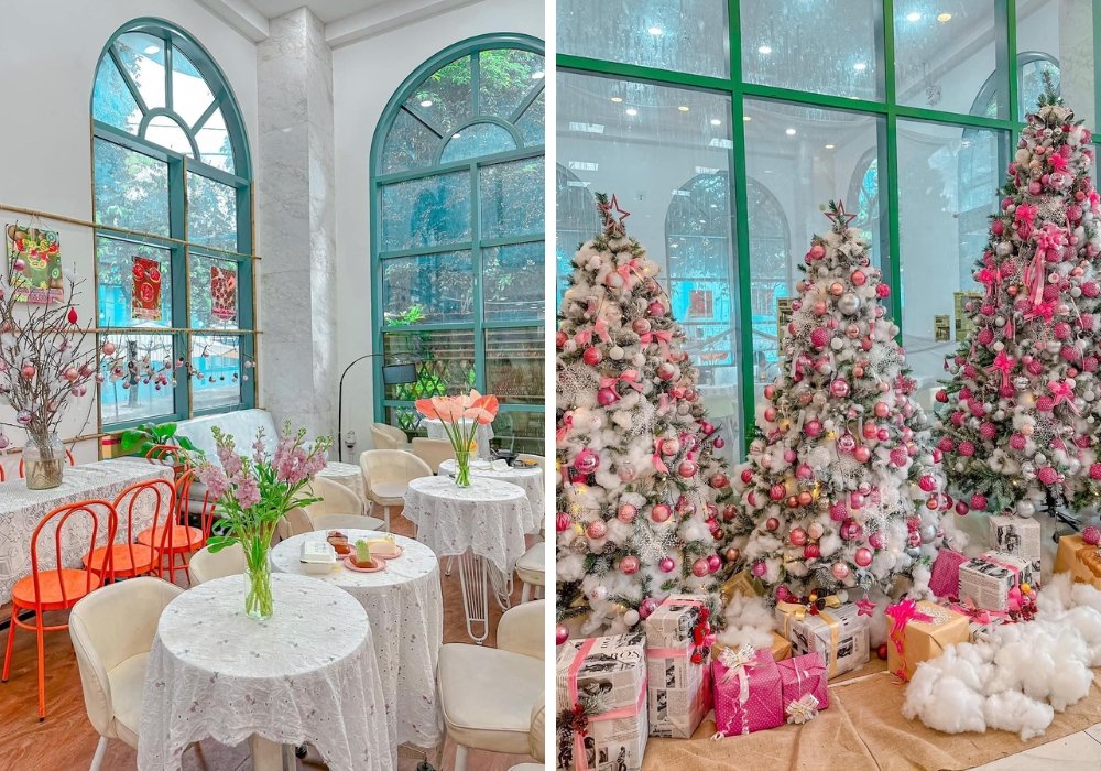 Quán cà phê với nội thất sáng sủa, trang trí cây thông Noel và quà tặng, tạo không khí lễ hội.